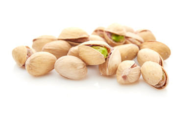 Heap of pistachios nuts isolated on the white