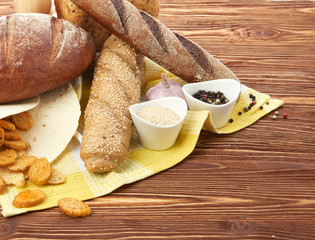 Fototapeta na wymiar Different bread and bread slices. Food background.