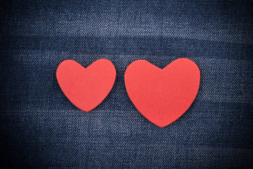 Red hearts on the jeans.