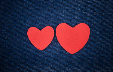 Red hearts on the jeans.