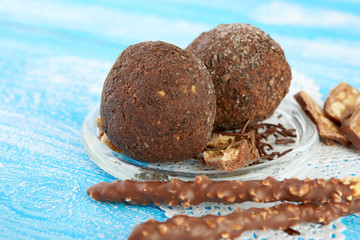 Cupcake with chocolate on wooden background