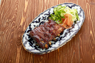 Meat on a grill with vegetables