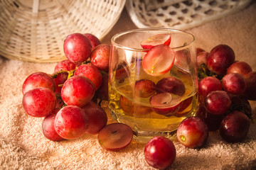 grapes and grape juice in a glass