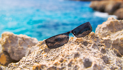 Fototapeta na wymiar reflecting in the sunglasses on the beach