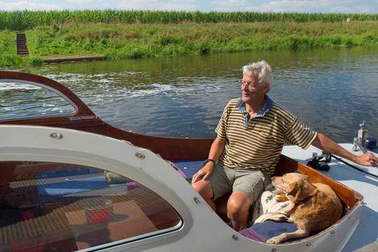 Man and dog in boat