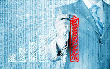 Business man drawing a growing graph