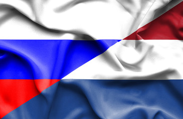 Waving flag of Netherlands and Russia