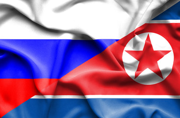 Waving flag of North Korea and Russia