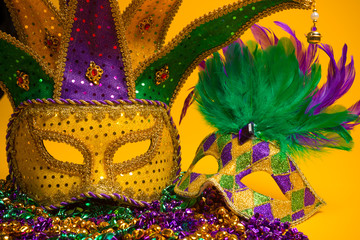 Colorful group of Mardi Gras or venetian mask or costumes on a y