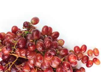 Red grapes on a white background.