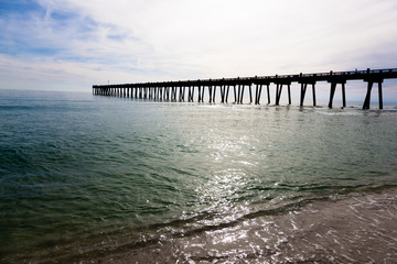 Pensacola pier with sun shining through
