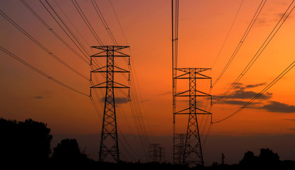 Pylon high voltage power line on sunset