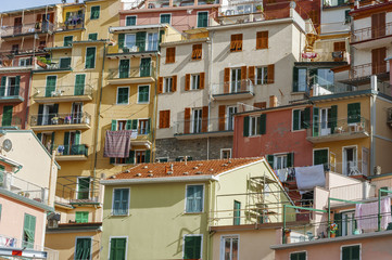 Fototapeta na wymiar Colorful residential buildings in Riomaggiore, Cinque Terre, Lig