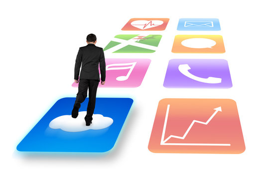 Rear view businessman surfing on shiny app icons white backgroun