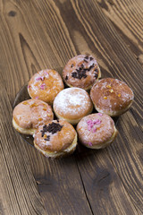 Jummy donuts on wooden table