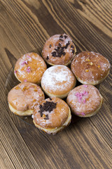 Jummy donuts on wooden table