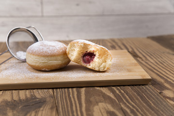 Jummy donuts on wooden table
