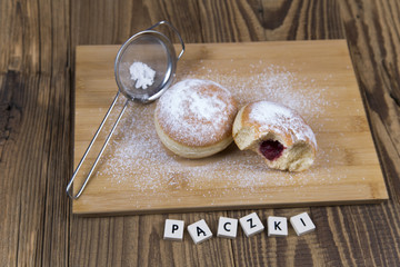 Jummy donuts on wooden table