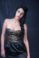 beautiful female fashion model on shine grey background