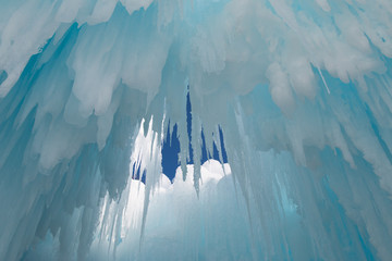 Icicles hang from the ceiling of an ice cave