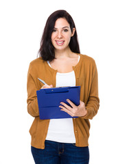 Fototapeta premium Woman write on clipboard