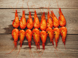 Boiled shrimps on wooden background