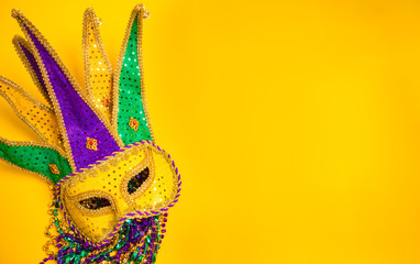 Mardi Gras Mask on yellow Background