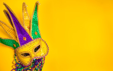 Mardi Gras Mask on yellow Background © Michael Flippo