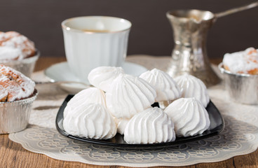 french meringue sweets muffins and coffee cup