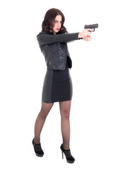 full length portrait of woman shooting with gun isolated on whit