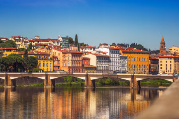 View of Ponte Vecchio with reflections in Arno River, Florence,