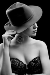 Portrait of beautiful sexy girl in black and white hat