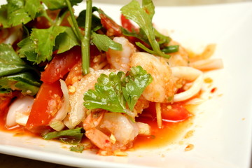 spicy salad with prawn shrimp, green herbs