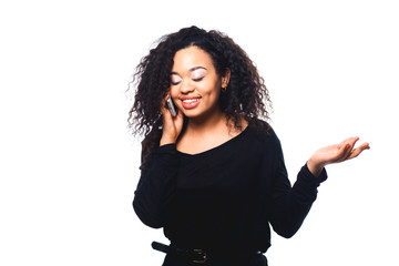 Beautiful African American woman talking on cell phone, isolated