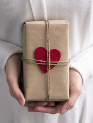Female hands holding gift