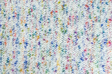 Colorful woolen texture. Knit shapes pattern as a background.
