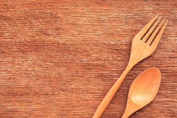 Wooden spoon and fork on table