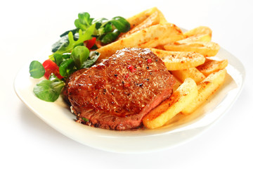Gourmet Grilled Meat with French Fries on Plate