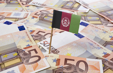 Flag of Afghanistan sticking in 50 Euro banknotes.(series)