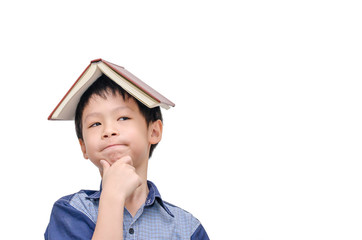 Asian boy with book on head thinking over white background