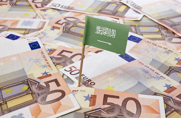 Flag of Saudi Arabia sticking in 50 Euro banknotes.(series)