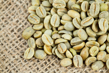 green coffee beans on sack