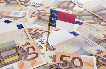 Flag of North Carolina sticking in 50 Euro banknotes.(series)