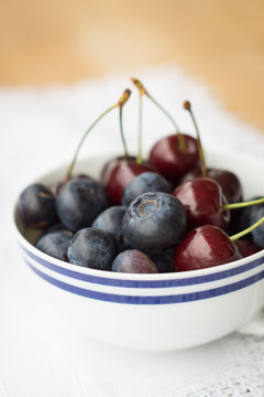 A Cup of Fresh Blueberries and Cherries