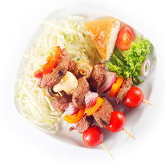 Aerial Shot of Kebabs with Bread and Veggies