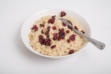 Oatmeal with Cranberries and Spoon
