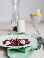 roasted beet salad with goat cheese, olive oil and sesame seeds