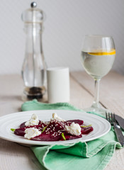 roasted beet salad with goat cheese, olive oil and sesame seeds