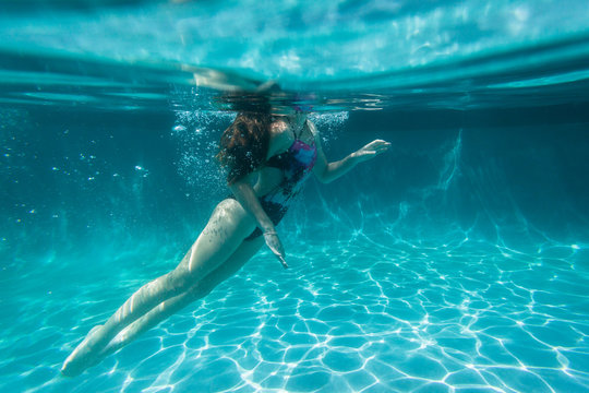 Girl Underwater Surfaces