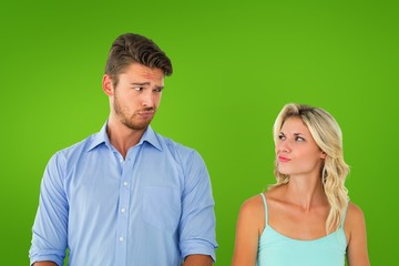 Composite image of young couple making silly faces
